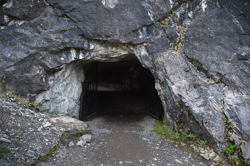 Entrance to dark cave in the rock