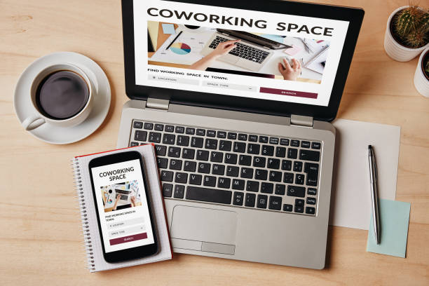 istock Coworking space concept on laptop and smartphone screen 1188885166