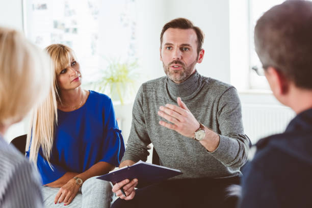 istock Mental health professional motivating patients 1188887126