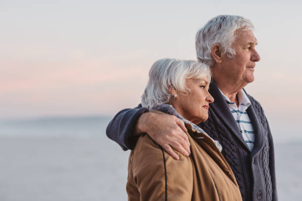istock Content senior couple looking out at the ocean view 1188887555