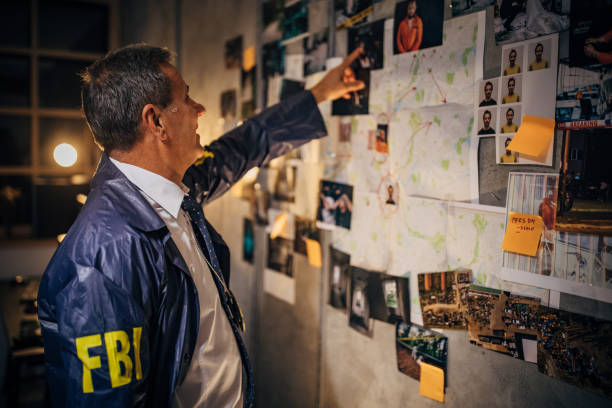 istock The old detective works alone late at night in his office 1188888390