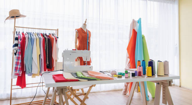istock Fashion designer working studio, with sewing items and materials on working table 1188889833