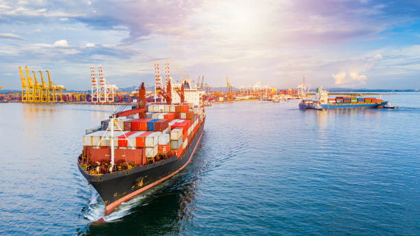istock Container ship carrying container for business freight shipping import and export, Aerial view container ship arriving in commercial port. 1188890686