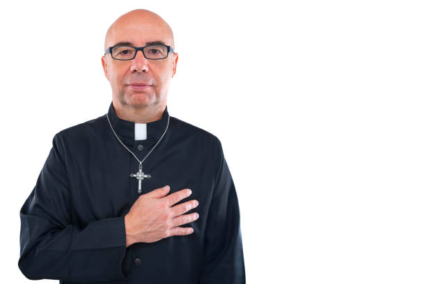 istock Priest blad hand in heart portrait with collar 1188894587