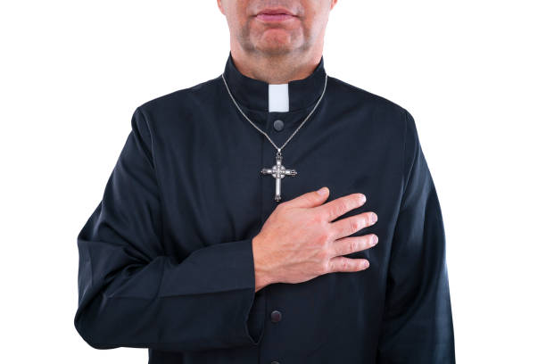 istock Priest blad hand in heart portrait with collar 1188894789