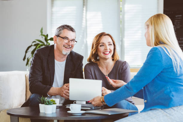 istock Smiling couple looking at psychotherapist 1188896041