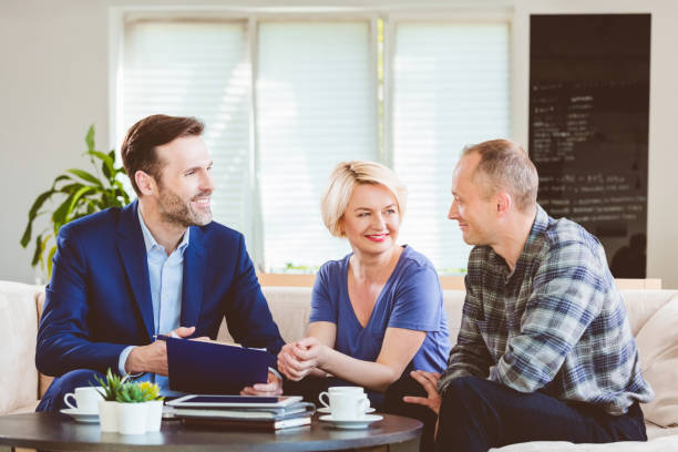 istock Smiling mental health coach looking at couple 1188896136