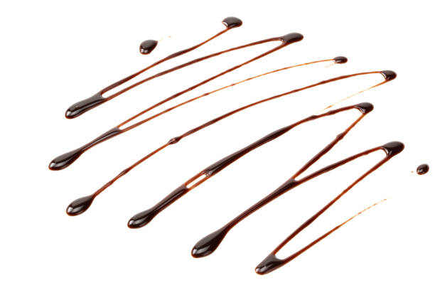 istock chocolate sauce isolated on white background. chocolate wave 1188898159