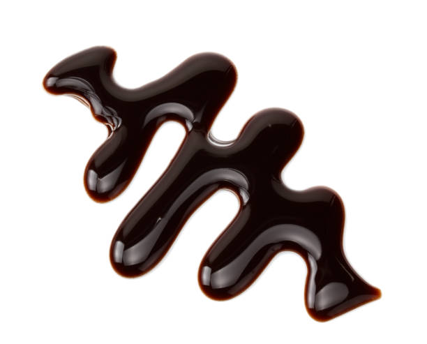 istock chocolate sauce isolated on white background. chocolate wave 1188898184
