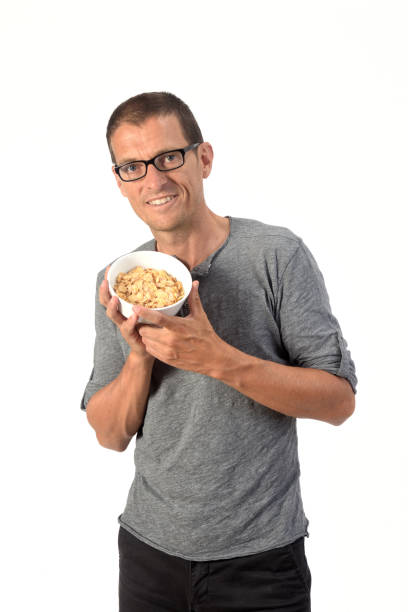 istock man with food on white background 1188900574
