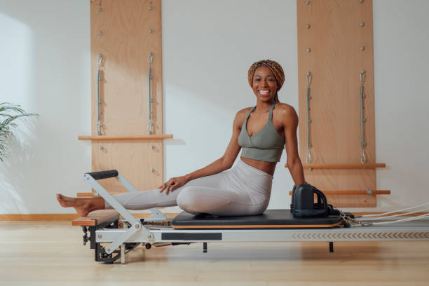 istock Sportswoman Practicing Pilates Reformer 1188900729