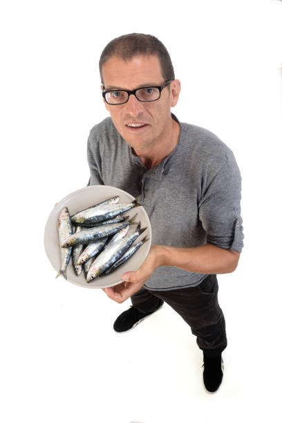 portrait of a man with food on white background