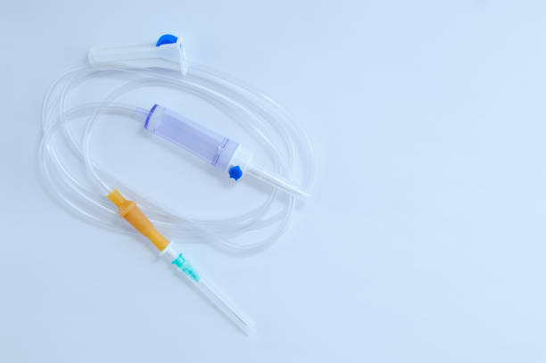 istock Infusion system with a dropper needle on a white table. Close-up. View from above. 1188901215