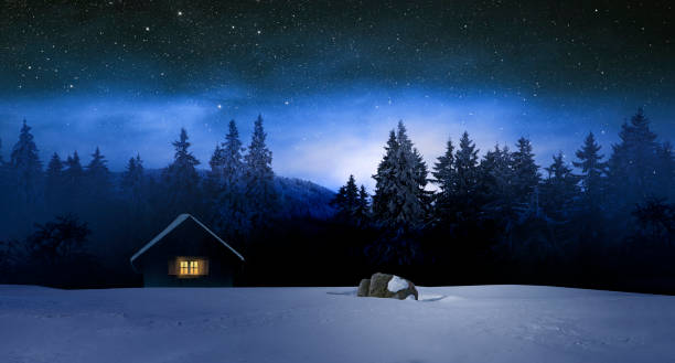istock Illuminated log cabin in winter night 1188901537