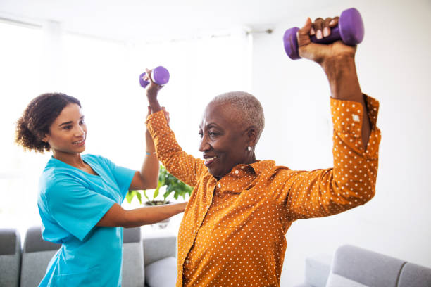 istock Physical Therapist With Her Patient at Home 1188903009