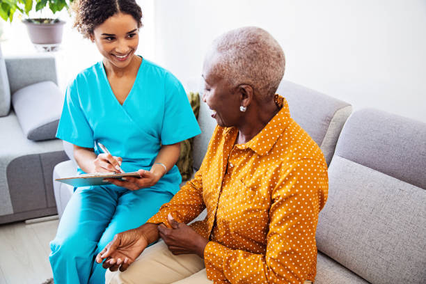 istock Nurse Visiting a Senior Female Patient at Home 1188903031