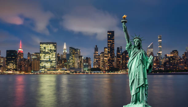istock manhattan skyline and lady liberty 1188903143