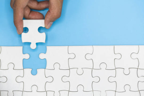 istock Human hands holding jigsaw  with word problem & solution.  symbol of association and connection. business strategy. 1188905912