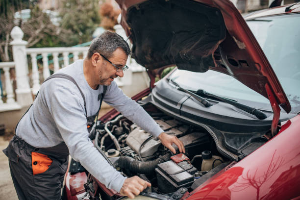 istock An old mechanic is repairing a car 1188905966