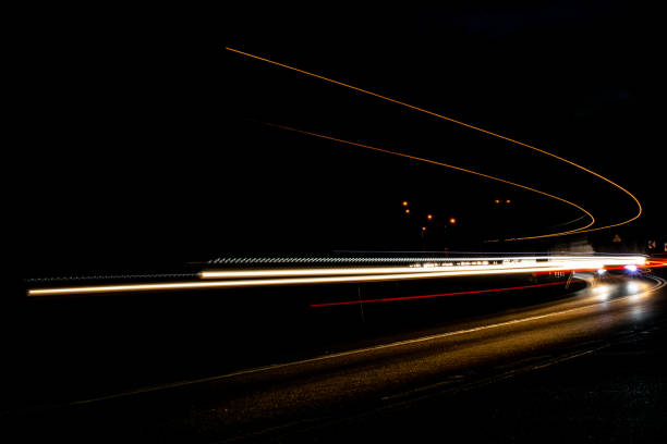 istock lights of cars with night 1188907211