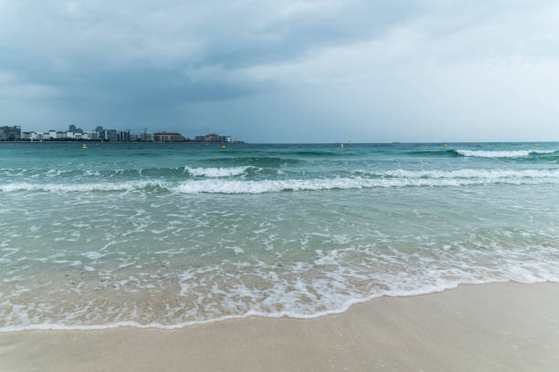 istock Dramatic Cloudy Sky for Thunderstorm, Sea waves at the beach in Arabian Sea. 1188908397