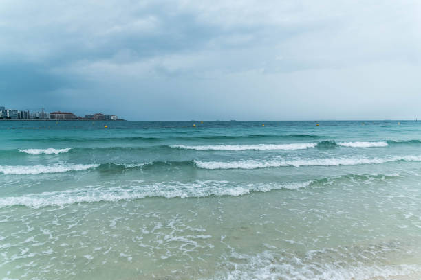 Dramatic Cloudy Sky for Thunderstorm, Sea waves at the beach in Arabian Sea.