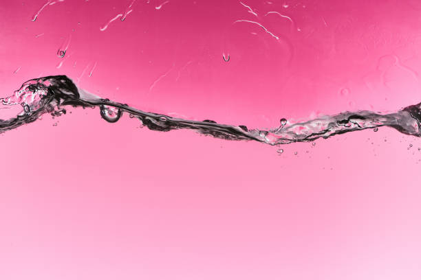 istock wavy fresh water on pink background with drops and bubbles 1188910548