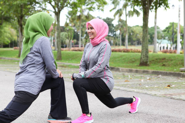 istock Two Muslim Women Stretching Before Running 1188911689