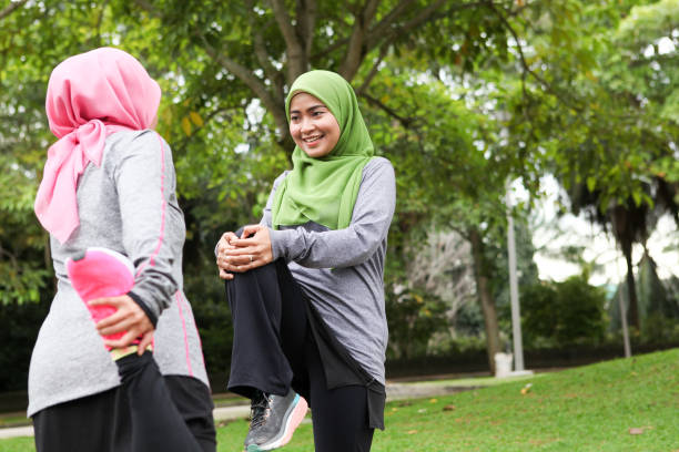 istock Two Muslim Women Stretching Before Running 1188911698