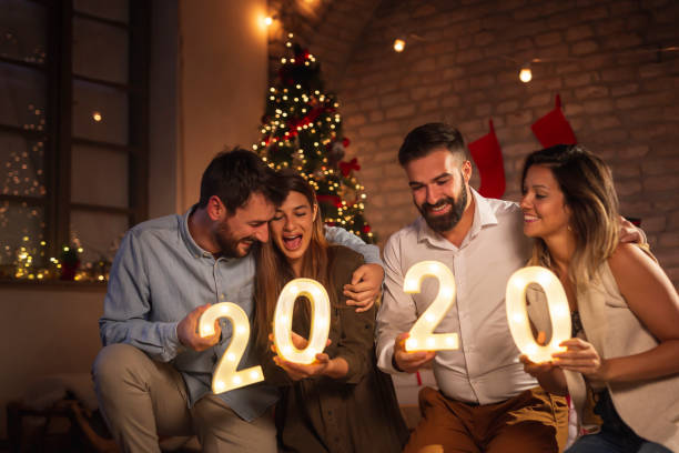 istock Friends holding illuminative numbers 2020 celebrating New Year 1188911714