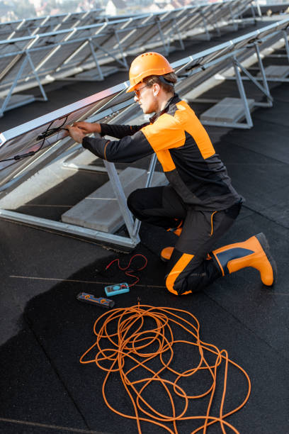 istock Electrician connecting solar panels 1188911766