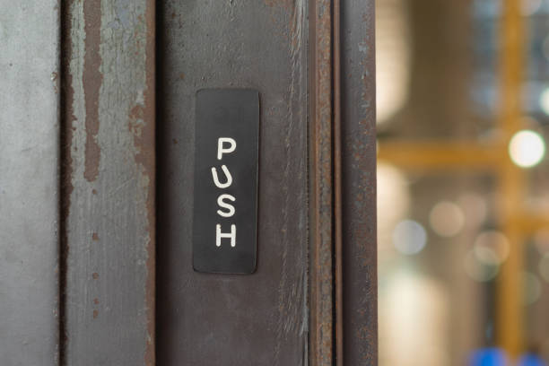 istock Restaurant door handle with push sign on glass doors 1188912075