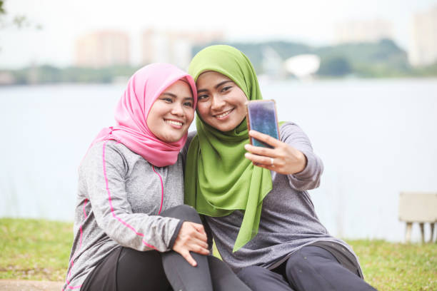 istock Two Muslim Women Runner Taking A Rest After A Run 1188912240