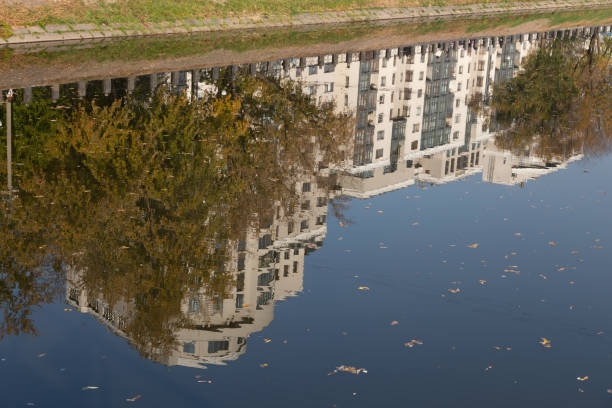 istock Reflection of a multi-storey building in the water 1188913000