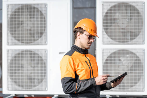 istock Workman servicing air conditioning or heat pump with digital tablet 1188915705