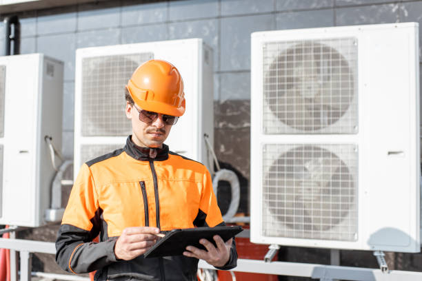 istock Workman servicing air conditioning or heat pump with digital tablet 1188915706