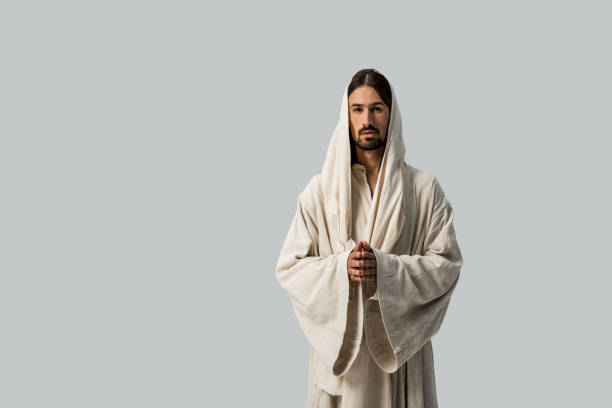 istock handsome man in hood standing with clenched hands isolated on grey 1188915769