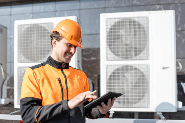 istock Workman servicing air conditioning or heat pump with digital tablet 1188915801