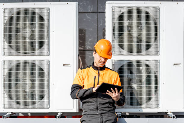istock Workman servicing air conditioning or heat pump with digital tablet 1188915834