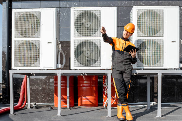 istock Workman servicing air conditioning or heat pump with digital tablet 1188915839