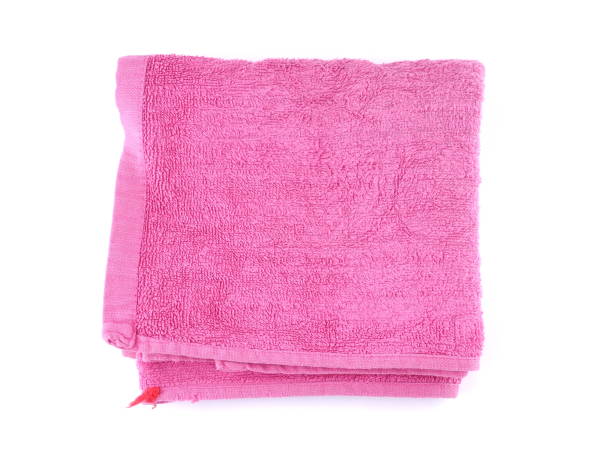 istock pink towel on a white background 1188917583