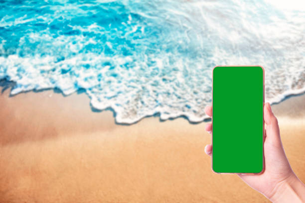 Hand Holding Mobile Phone with Chroma Green