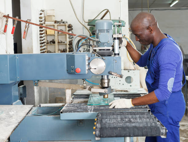 istock Craftsman working on glass drilling machine 1188919793