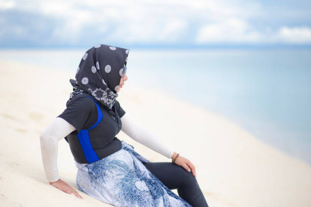 istock moslem woman on the beach 1188919882