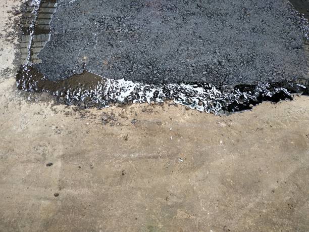 istock hole repair in asphalt pavement 1188920059