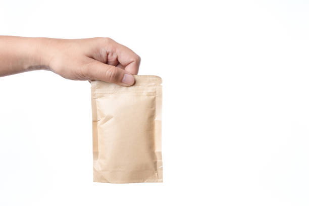 istock Hand holding brown paper packaging bag with zipper lock 1188921592