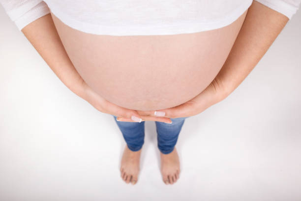 Detail of Pregnant belly view from above