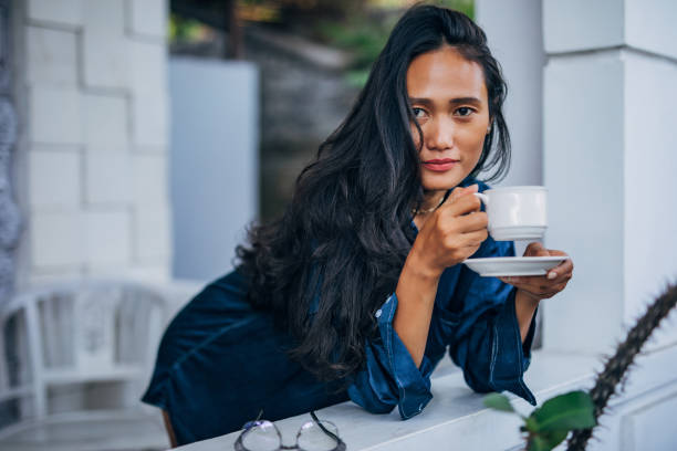 istock Young woman relaxing at home 1188923875