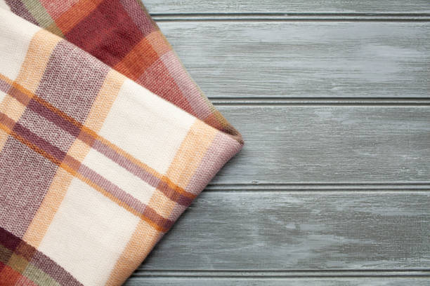 Winter blanket on grey wood background