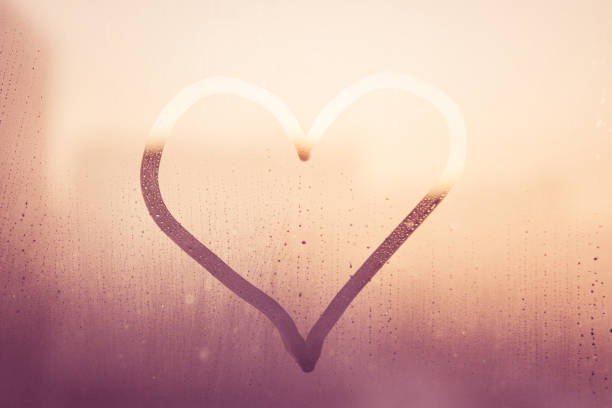 istock heart on a foggy window. 1188925531